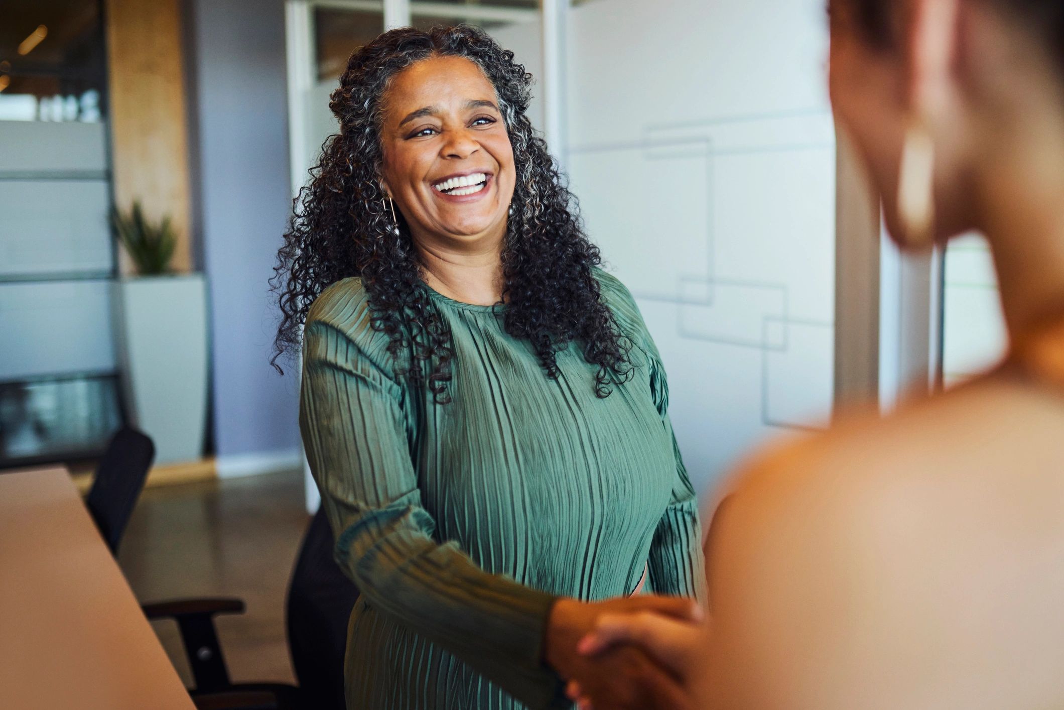 Business handshake representing partnership enquiries